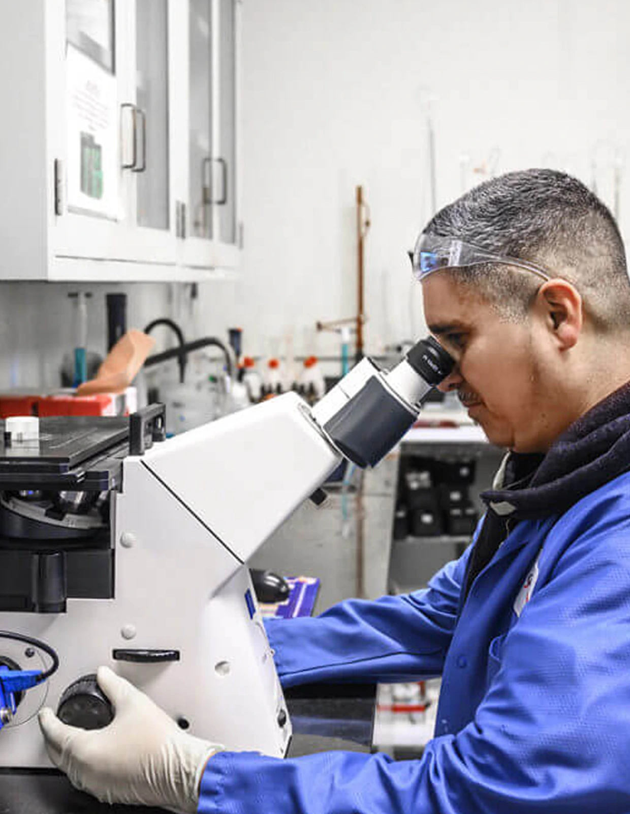 Man looking at equipment during manufacturing
